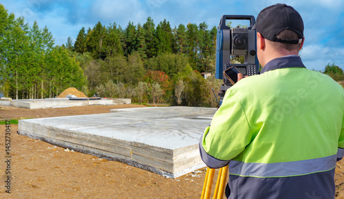 Land surveyor using total s...