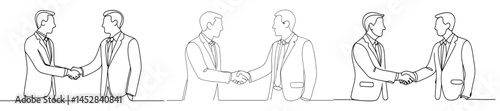 Business professionals shaking hands in a networking setting during a formal meeting