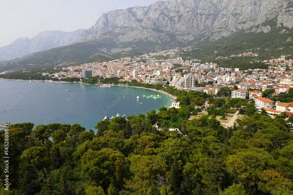 Makarska, Croatia. Coastal town, sea and mountains, Biokovo park. Aerial photography from a drone. Croatian town Makarska, Croatia. Coastal town, sea and mountains, Biokovo park. Aerial photography from a drone. Croatian town