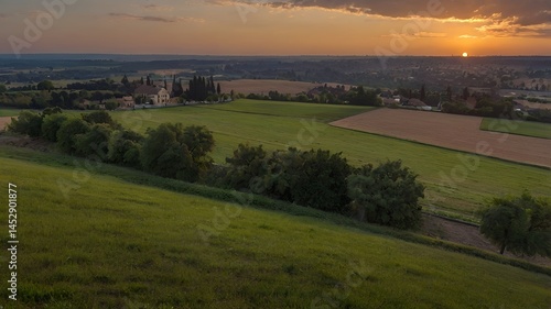 A large field with a level lawn stretching out over the horizon at sunset.