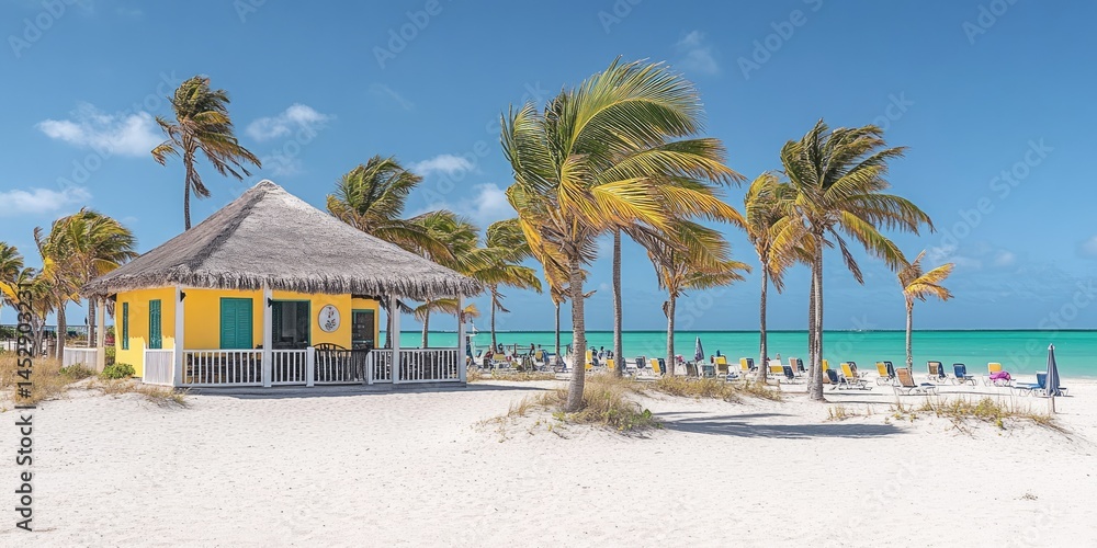 Obraz premium Sunny tropical beach hut on white sand.