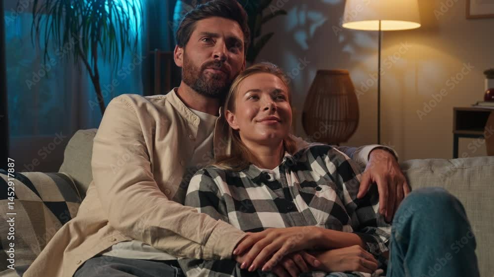 Relaxed Caucasian woman man love couple affectionate happy family at evening night insomnia talking husband wife together relax rest cuddling on couch sofa cozy home casual conversation romantic date