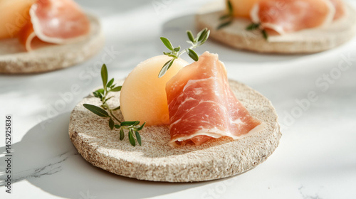 Obraz na płótnie Savory Prosciutto with Fresh Melon on Rustic Plate w salonie