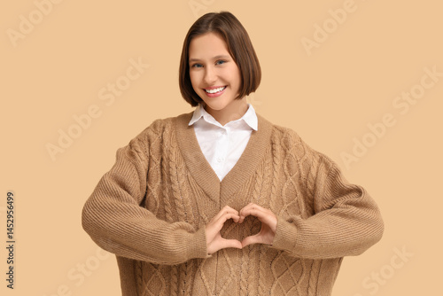 Pretty young woman making h...
