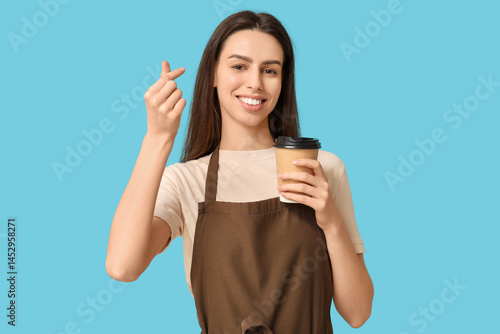 Young female barista with c...