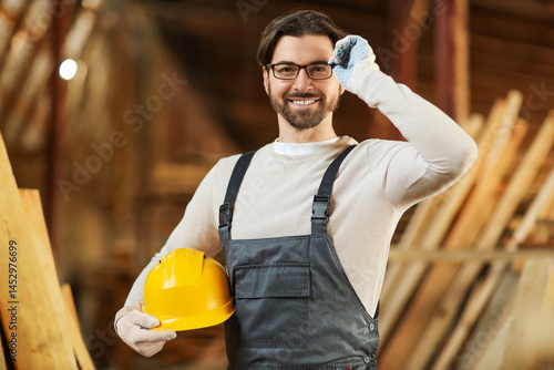Male carpenter in eyeglasse...