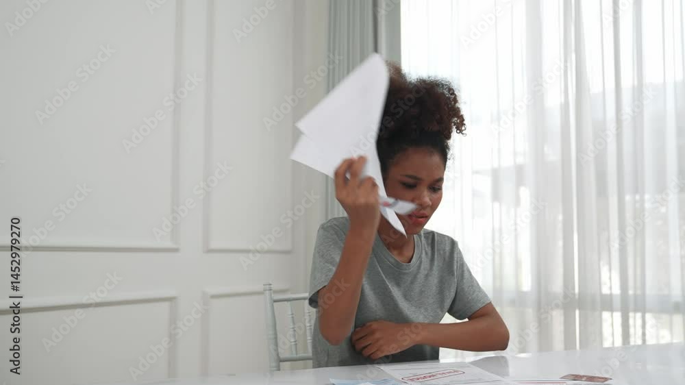 Stressed young woman has financial problems with credit card debt to pay crucial show concept of bad personal money and mortgage pay management crisis.