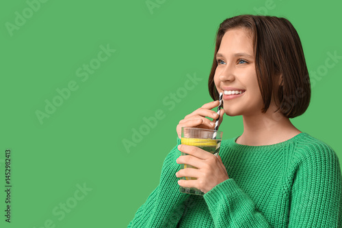 Pretty young woman drinking...