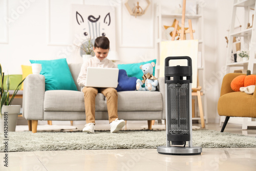 Electric heater on floor ag...