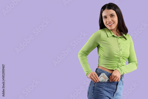 Young woman with money in h...