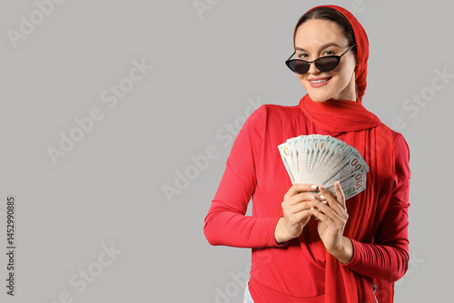 Beautiful woman with dollar...