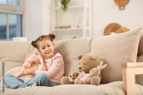 Cute little girl with knitt...
