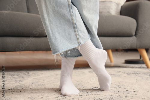 Legs of young woman in whit...