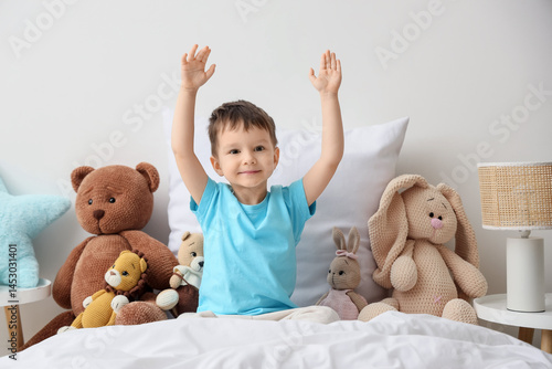 Cute little boy with toys s...