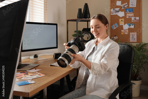 Female photographer with ca...