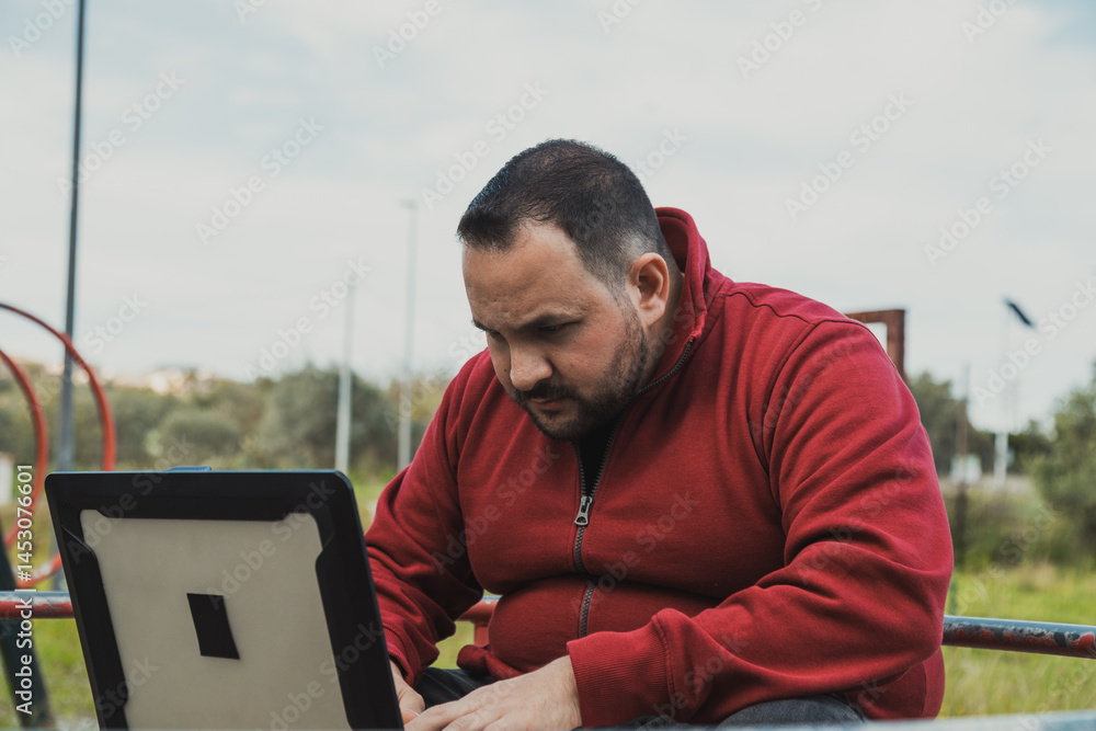 Man Doing His Digital Job From The City Park