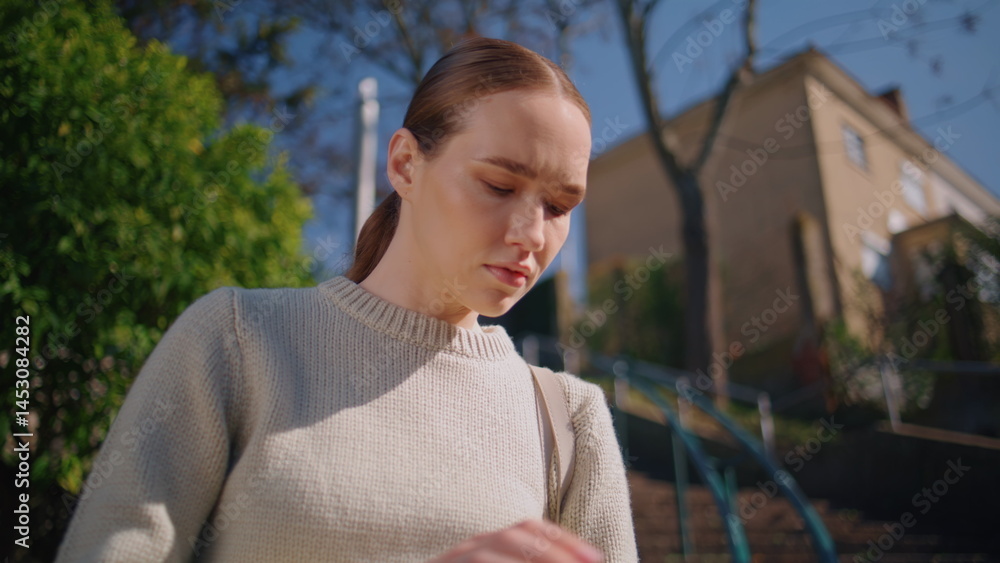 Attractive girl checking schedule sunlight park closeup. Student flipping book