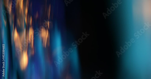 Abstract light leaks on black background with copy space. Studio lens flare bokeh effect. 4k video