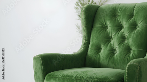 Green velvet armchair featuring a tufted back design and sturdy black legs. Ideal for adding a touch of luxury and comfort to modern interiors on white background.