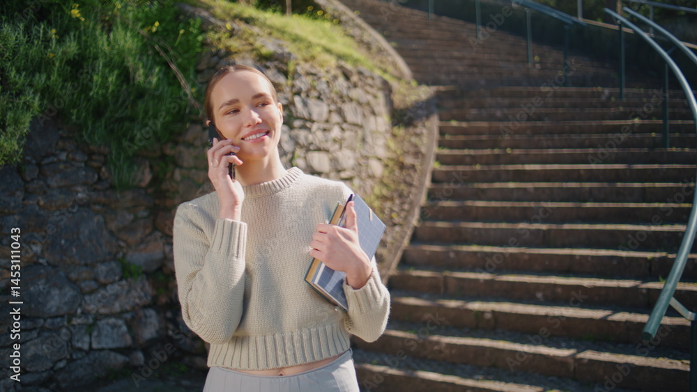 Happy lady calling smartphone strolling staircase at beautiful city closeup