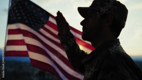 Silhouette Of A Soldier Salutes In Front American Flag At Sunset Memorial Day