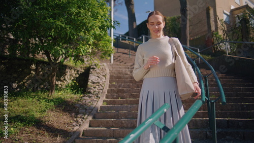 Obraz na płótnie Happy teacher strolling staircase green trees nature. Romantic lady taking book w salonie