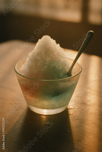 Obraz na płótnie Shaved ice dessert with pastel syrup in nostalgic summer sunset light w salonie