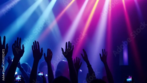 Wallpaper Mural Silhouetted Hands Raised in Excitement Under Blue and Purple Stage Lighting at Night Festival Event Torontodigital.ca