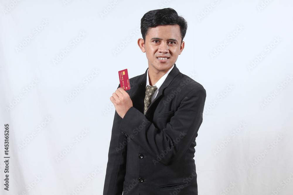 Asian businessman smiling showing credit card isolated on white background Asian businessman smiling showing credit card isolated on white background