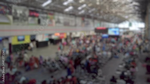 Wallpaper Mural Bokeh view of passengers in waiting hall at Chennai Central railway station, Chennai, India. Blurred background footage. Torontodigital.ca