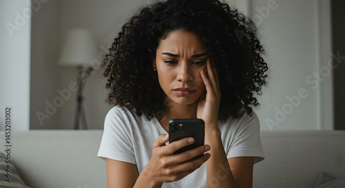 Worried woman looking at phone bad news online dating stress anxiety upset sad disappointed with message