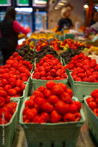 fresh strawberries and raspberries at the market