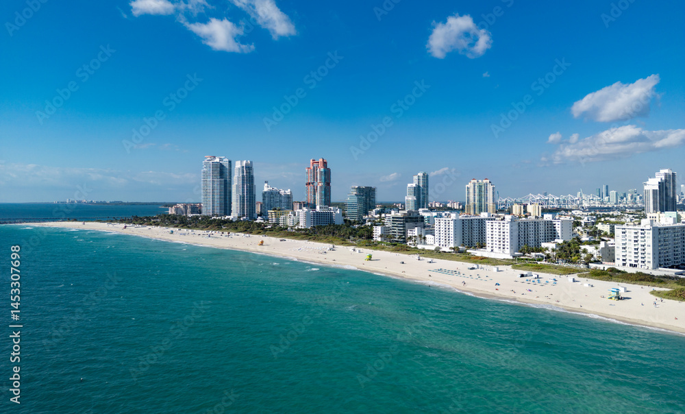 Obraz premium Miami Beach skyline aerial view. Miami city from drone. Tropical Miami scene. Miami district sky view. Famous oceanfront. Panoramic coastline. South beach panorama view. Aerial coastline.