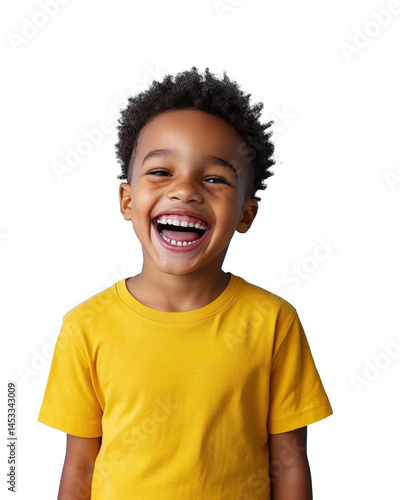 Happy child laughing in a bright yellow shirt