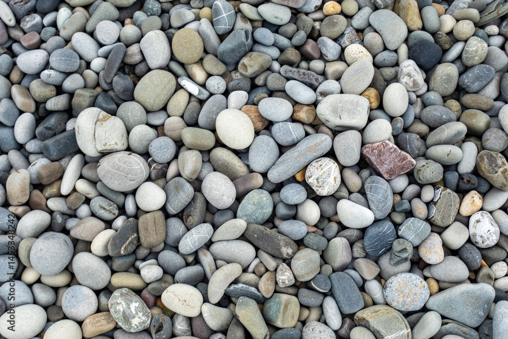 A pile of rocks with a single rock in the middle A pile of rocks with a single rock in the middle