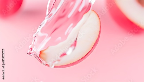 Wallpaper Mural A translucent pink fruit slice submerged in flowing water against a blurred pink background Torontodigital.ca