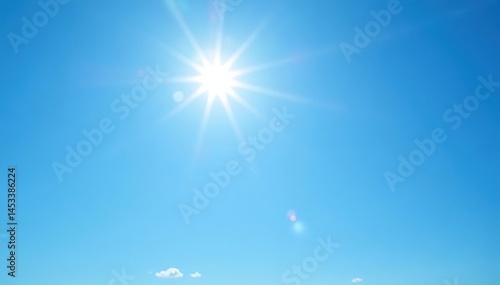 Bright sun illuminates a clear blue sky, no clouds , bright sunlight, open sky