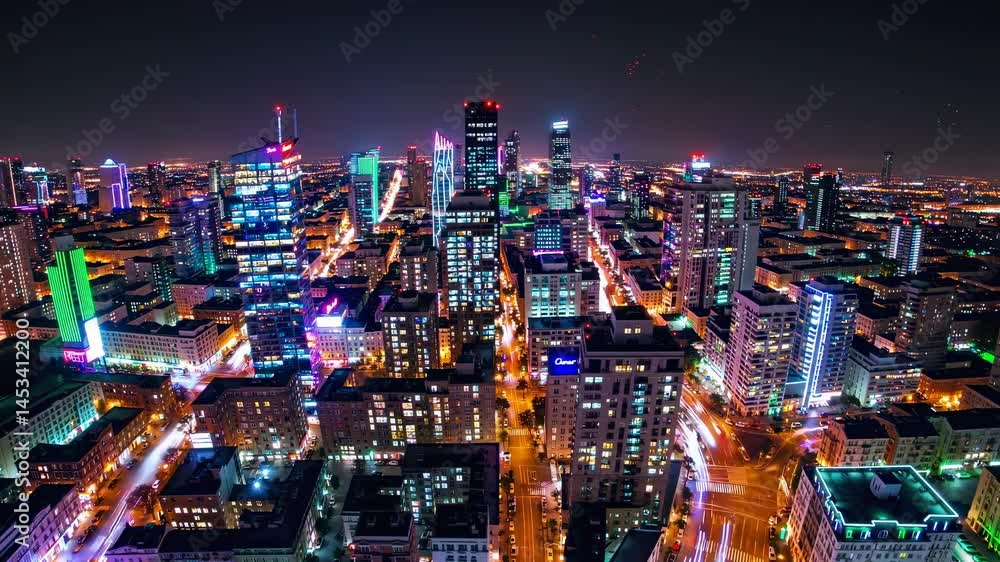 Aerial view of a vibrant cityscape at night, showcasing colorful neon lights and bustling streets, reminiscent of a futuristic video game setting. Aerial view of a vibrant cityscape at night, showcasing colorful neon lights and bustling streets, reminiscent of a futuristic video game setting.