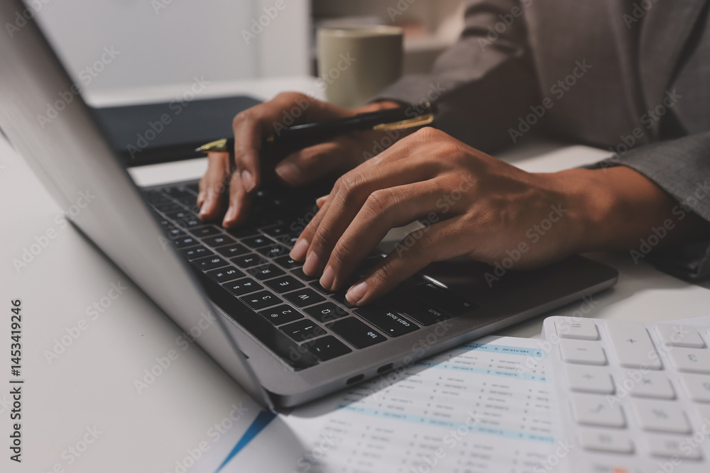 Working from home, Closeup business woman using laptop computer and analyzing financial report. Working from home, Closeup business woman using laptop computer and analyzing financial report.