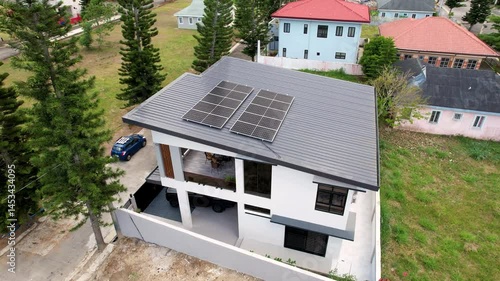 Aerial view of a fairly large Solar Panel Installation mounted on a residential rooftop in Tagaytay, Philippines.