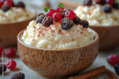 Bowl filled with mashed potatoes, topped with cranberries.