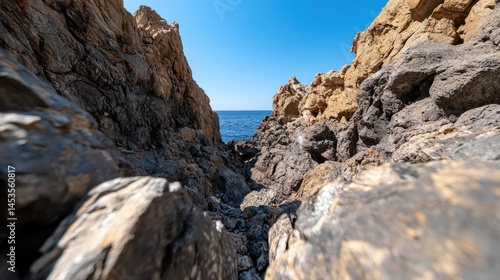 Majestic Rocky Cliff Against a Clear Blue Sky Evoking Natural Beauty