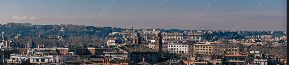 Fototapeta premium Panoramic View of Rome Skyline with St. Peter’s Basilica at Sunset