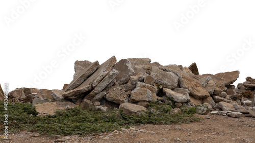 Concrete debris from road demolition isolates piled up on the ground.