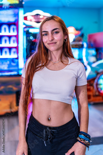 Obraz na płótnie Young woman enjoying weekend at the arcade, entertainment and fun w salonie