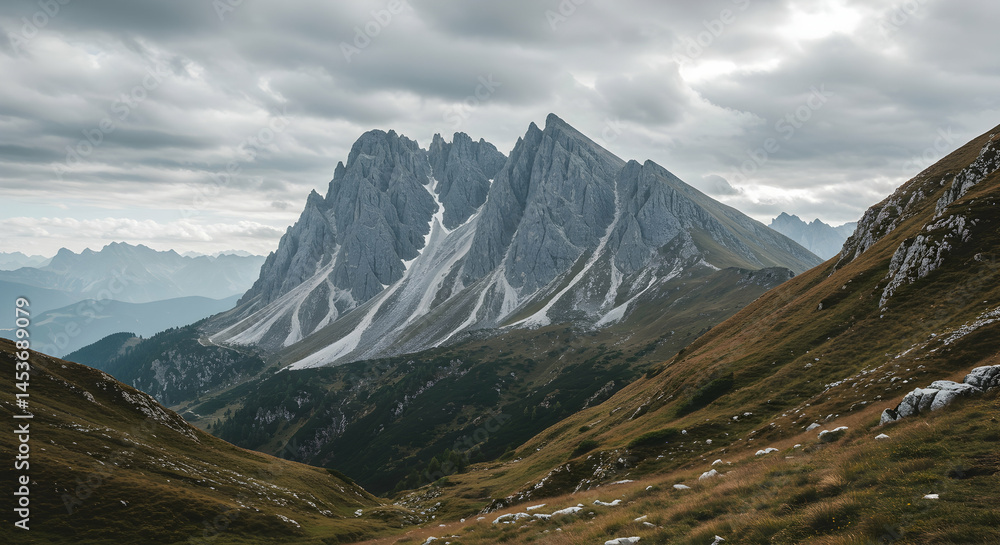 Fototapeta premium Majestic Mountain Range Under Cloudy Sky in Dolomites Region