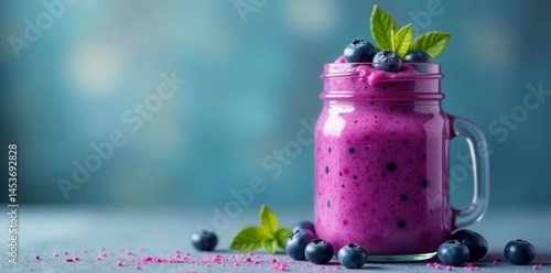 Rich purple smoothie,topped with blueberries in mason jar, tasty, vibrant