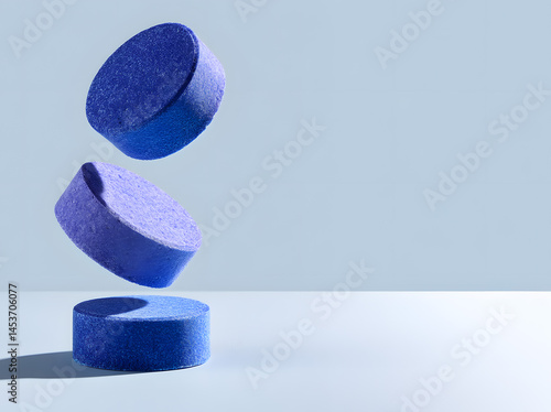 Toilet blue tabs/tablets on blue background with copy space for text. Sanitary, hygiene, Toilet Bowl Tablets, clean home, 