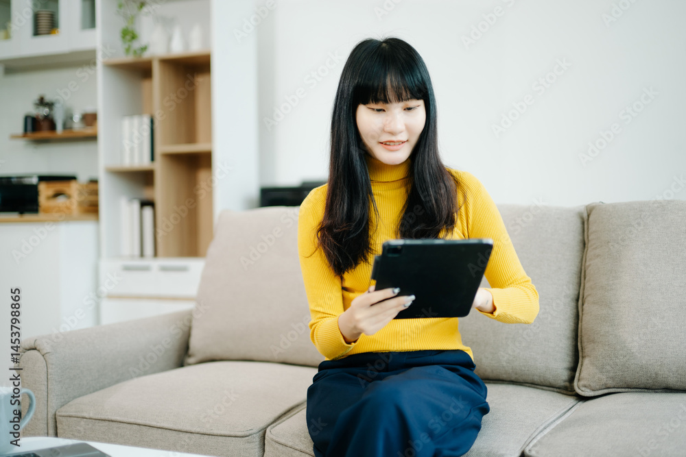 Young woman relaxing on couch using smartphone and smiling while browsing onlineuse cellphone Young woman relaxing on couch using smartphone and smiling while browsing onlineuse cellphone
