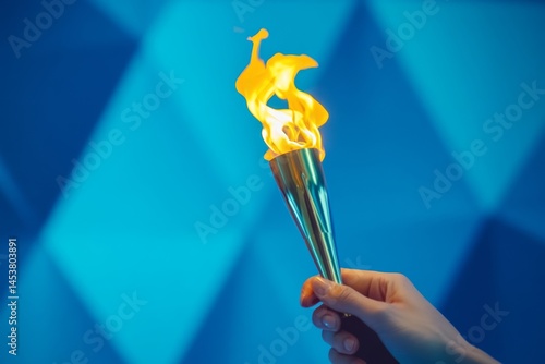 Obraz na płótnie Hand holding flaming torch with fire and glowing embers. w salonie